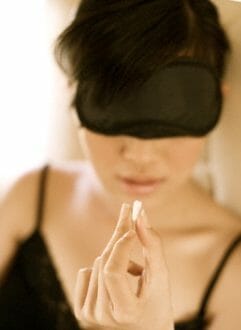 Luxury Travel: Jet Lag Solutions 8 woman taking sleeping pill on jet Luxury Travel: Jet Lag Solutions - EAT LOVE SAVOR International Luxury Lifestyle Magazine