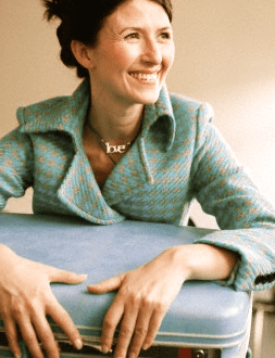 The Romance of Traveling Alone 6 Woman with blue suitcase1 The Romance of Traveling Alone - EAT LOVE SAVOR International Luxury Lifestyle Magazine