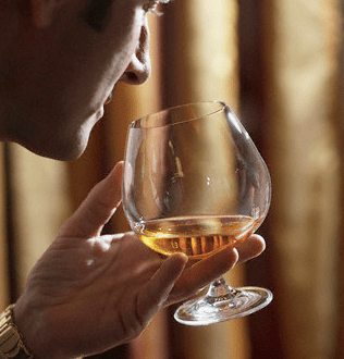 Cognac: The History and the Art of Enjoying Cognac 40 man and snifter Cognac: The History and the Art of Enjoying Cognac - EAT LOVE SAVOR International Luxury Lifestyle Magazine