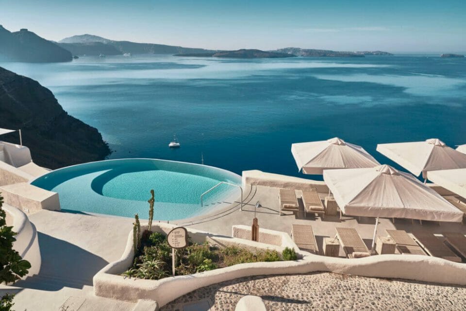 Discover the Ultimate Greek Escape for 2021: MYSTIQUE, a Luxury Collection Hotel Cut into an Extraordinary Sea Side Landscape 2 Mystique Hotel infinity pool Discover the Ultimate Greek Escape for 2021: MYSTIQUE, a Luxury Collection Hotel Cut into an Extraordinary Sea Side Landscape - EAT LOVE SAVOR International Luxury Lifestyle Magazine